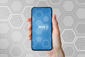 holding phone that says web3